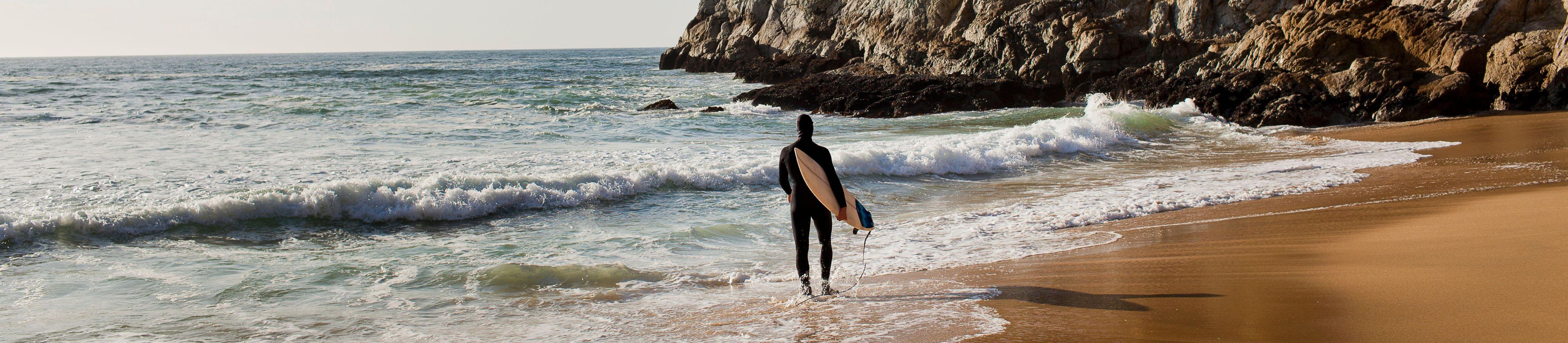 USA, California, Montara, Surfboard on beach at sunset - Image ID: 2H3N5RA (RF)